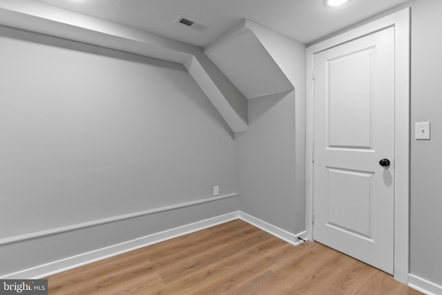 bonus room with light hardwood / wood-style flooring