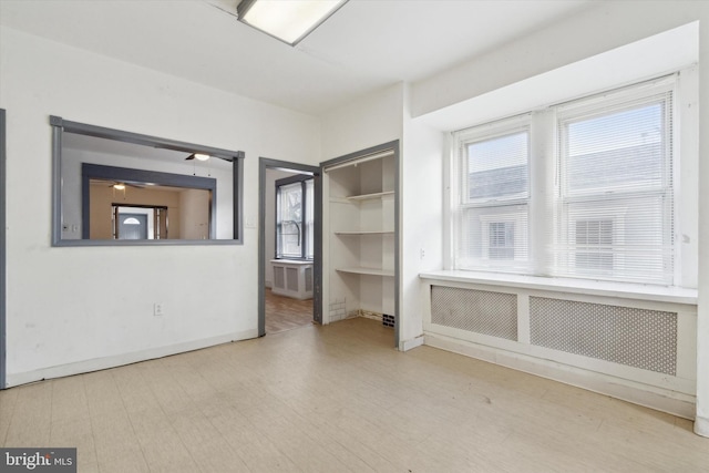 unfurnished room featuring ceiling fan