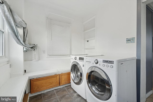 laundry area with separate washer and dryer