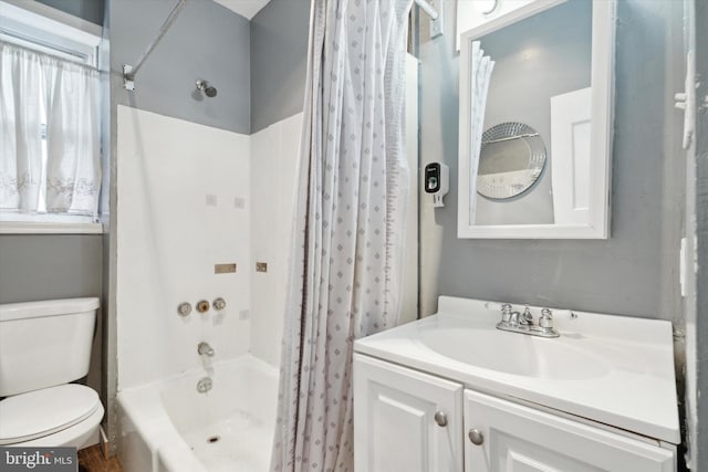 full bathroom featuring vanity, shower / bath combination with curtain, and toilet