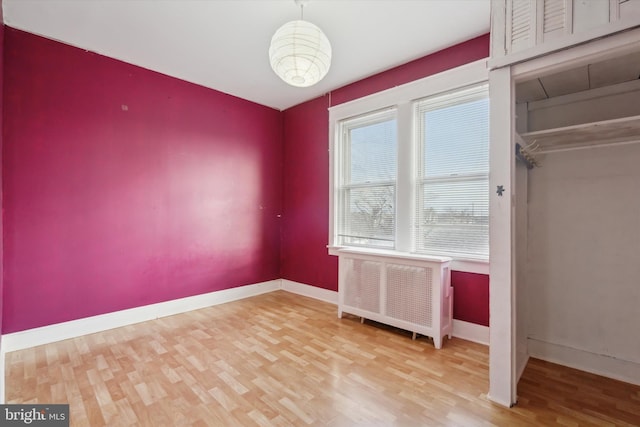 interior space featuring hardwood / wood-style flooring and radiator