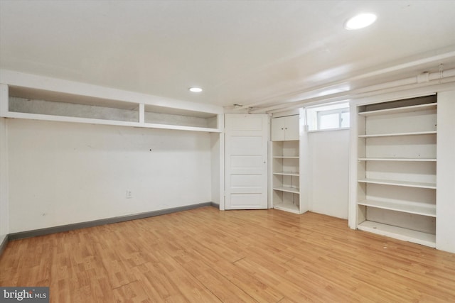 spacious closet featuring light hardwood / wood-style floors