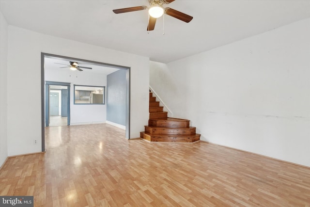 unfurnished room with ceiling fan and light hardwood / wood-style floors