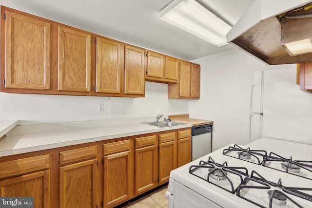 kitchen with sink, light tile patterned floors, extractor fan, and white appliances