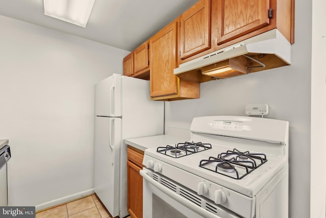 kitchen with white range with gas stovetop, light tile patterned floors, and stainless steel dishwasher