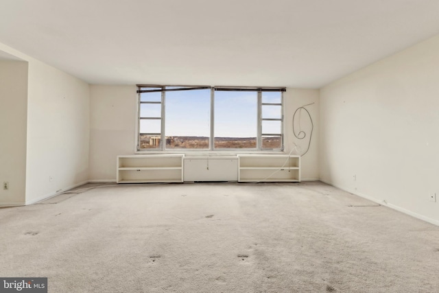 empty room featuring light colored carpet