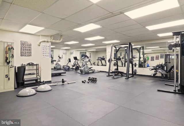 exercise room featuring a paneled ceiling