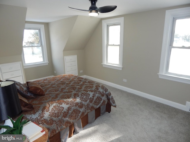 bedroom with ceiling fan, light carpet, and lofted ceiling