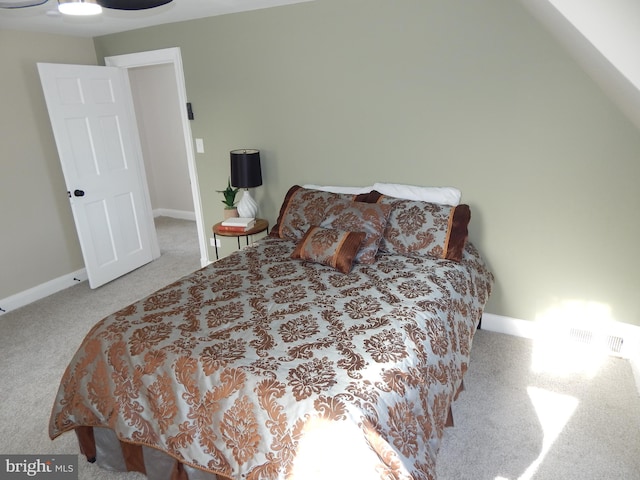 bedroom featuring light colored carpet