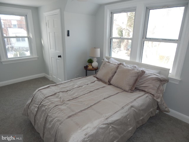 carpeted bedroom with vaulted ceiling