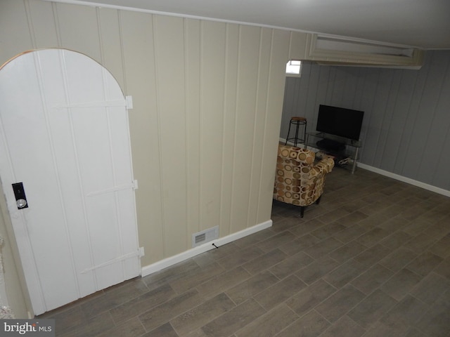 unfurnished room featuring dark hardwood / wood-style flooring