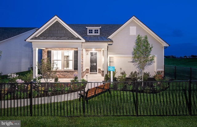 craftsman-style home with a front yard