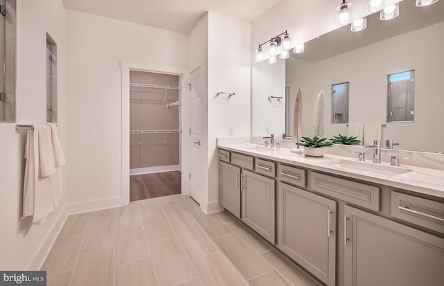 bathroom with tile patterned flooring and vanity