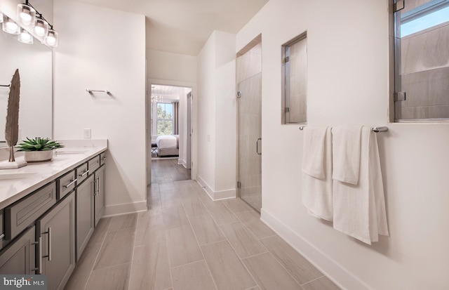 bathroom featuring vanity and an enclosed shower