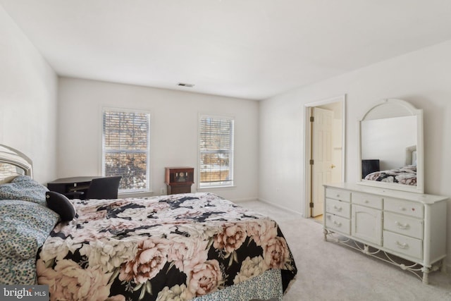 bedroom with light carpet