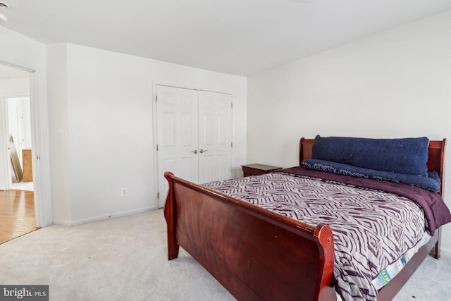 carpeted bedroom featuring a closet