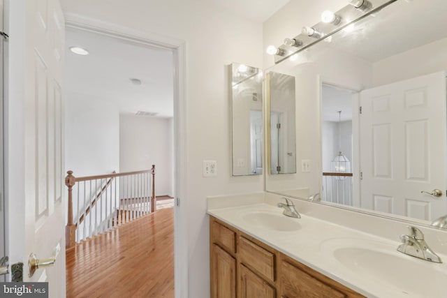 bathroom featuring wood-type flooring and vanity