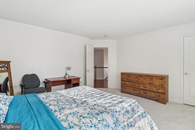 bedroom featuring light carpet