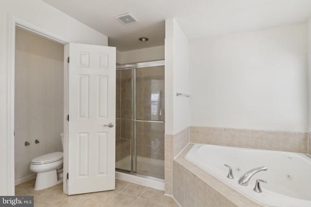 bathroom featuring tile patterned flooring, toilet, and independent shower and bath