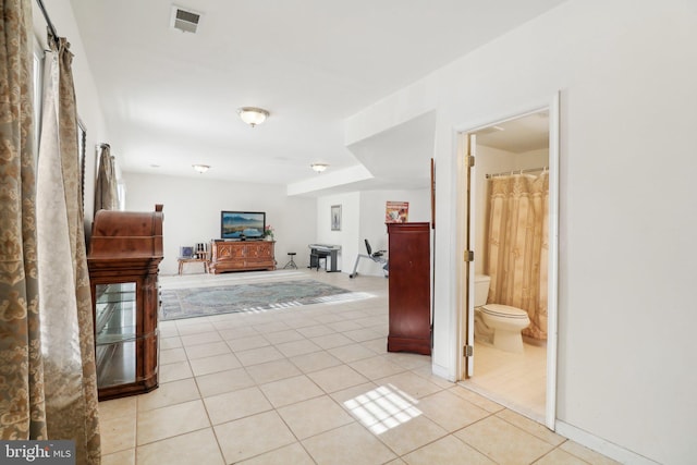 hallway with light tile patterned floors