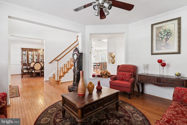 living room with hardwood / wood-style floors and ornamental molding