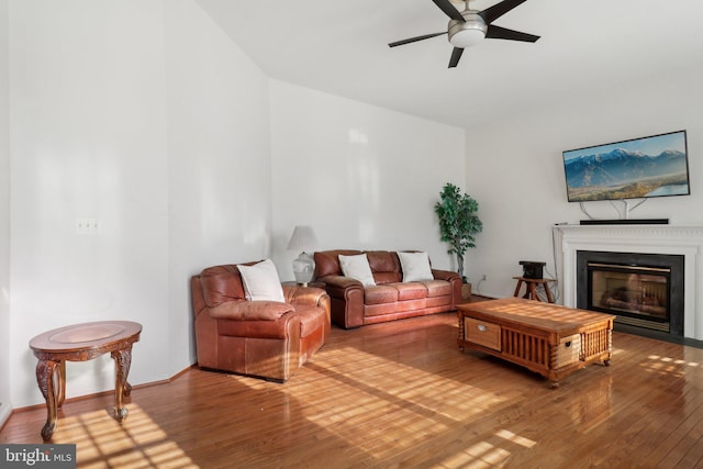 living room with hardwood / wood-style flooring and ceiling fan