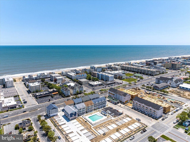 birds eye view of property featuring a view of the beach and a water view