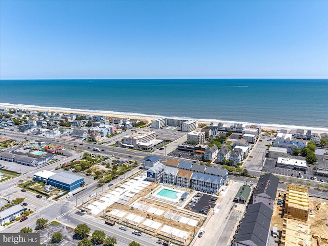 aerial view featuring a water view and a beach view