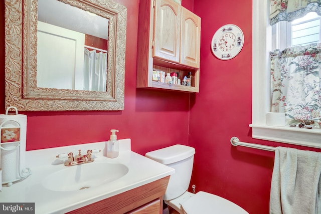 bathroom with vanity and toilet