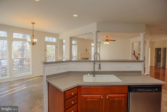 kitchen with sink, decorative light fixtures, dishwasher, light tile patterned floors, and ceiling fan with notable chandelier