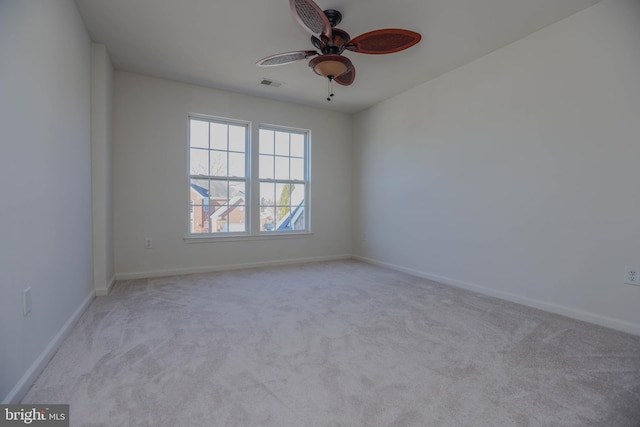 unfurnished room with ceiling fan and light colored carpet