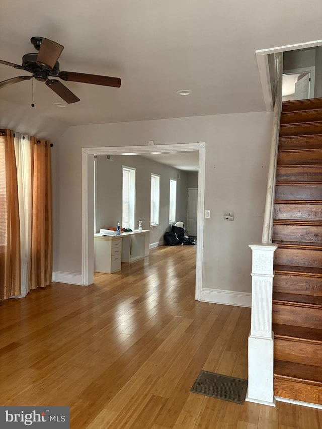 interior space featuring hardwood / wood-style flooring and ceiling fan