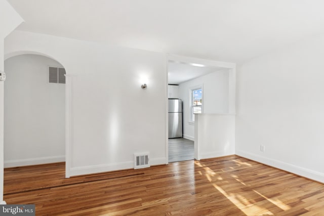 empty room featuring hardwood / wood-style floors