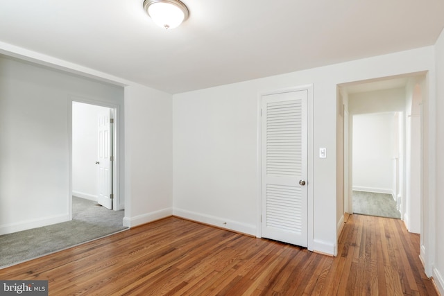 unfurnished room featuring hardwood / wood-style flooring