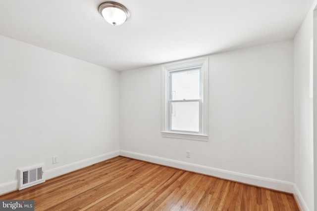 unfurnished room with light hardwood / wood-style floors