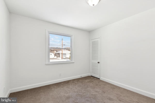 empty room featuring light carpet