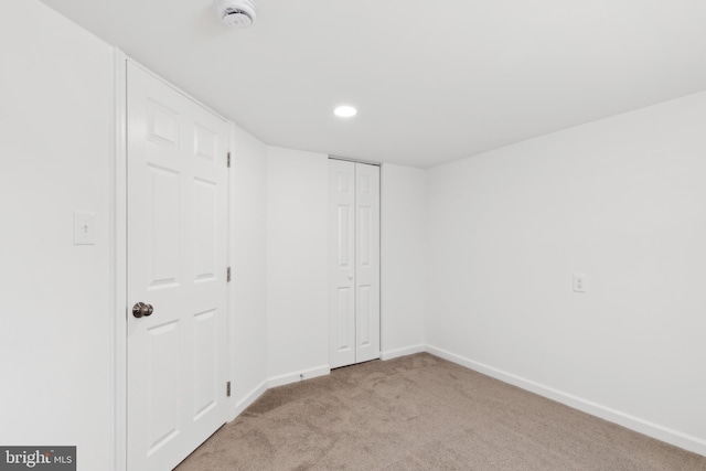 interior space featuring light colored carpet