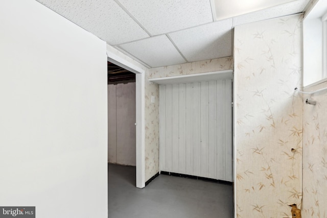 basement featuring a paneled ceiling