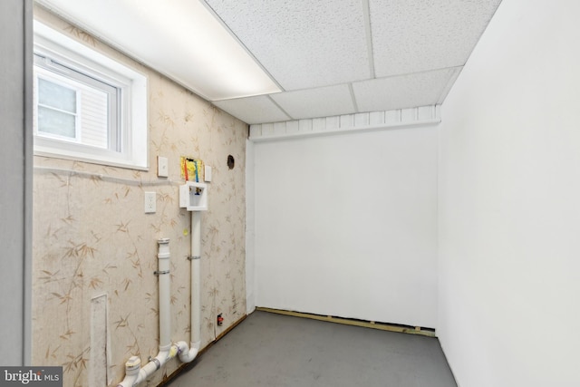 basement featuring a paneled ceiling