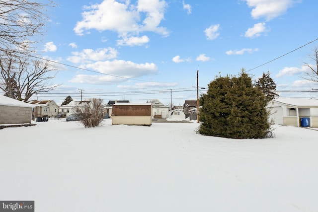 view of yard layered in snow