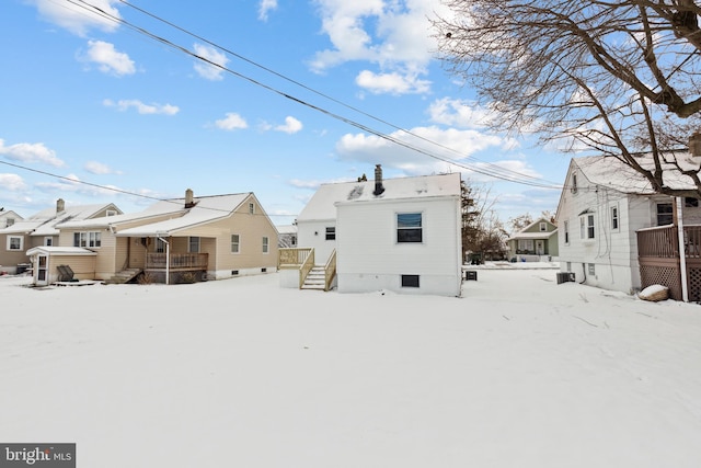 view of snow covered house