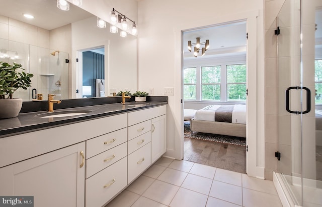 bathroom featuring vanity, tile patterned floors, and walk in shower