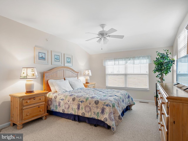 carpeted bedroom featuring vaulted ceiling and ceiling fan