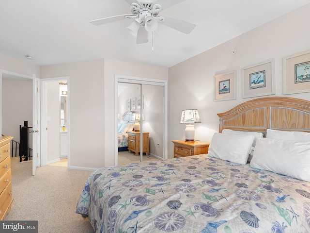 carpeted bedroom with ceiling fan and a closet