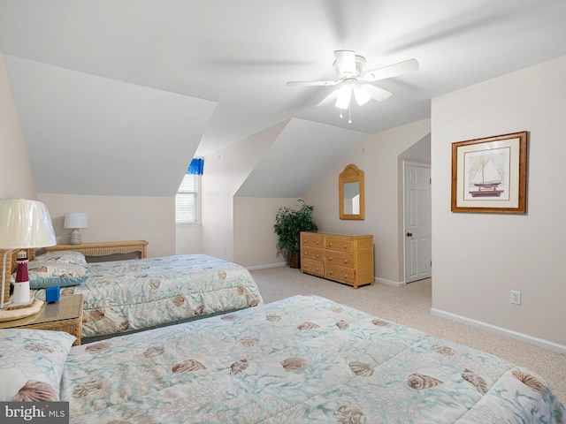 carpeted bedroom featuring ceiling fan and vaulted ceiling