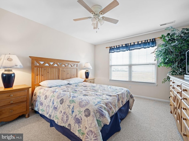 bedroom with ceiling fan and light colored carpet