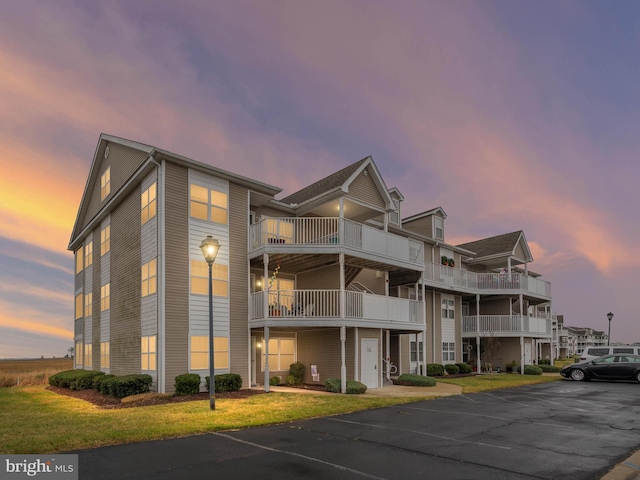 view of outdoor building at dusk