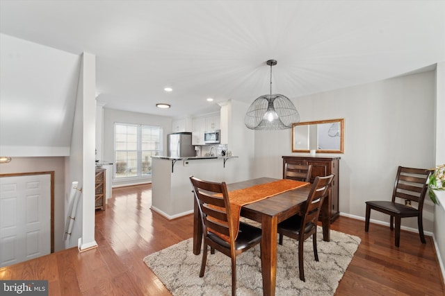 dining space featuring dark hardwood / wood-style floors