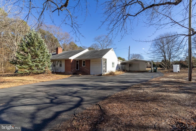 view of side of home with a carport