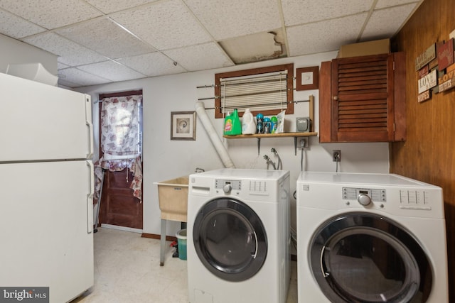 washroom with cabinets and separate washer and dryer